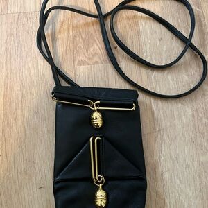 Chic Black Crossbody Bag with Gold Details